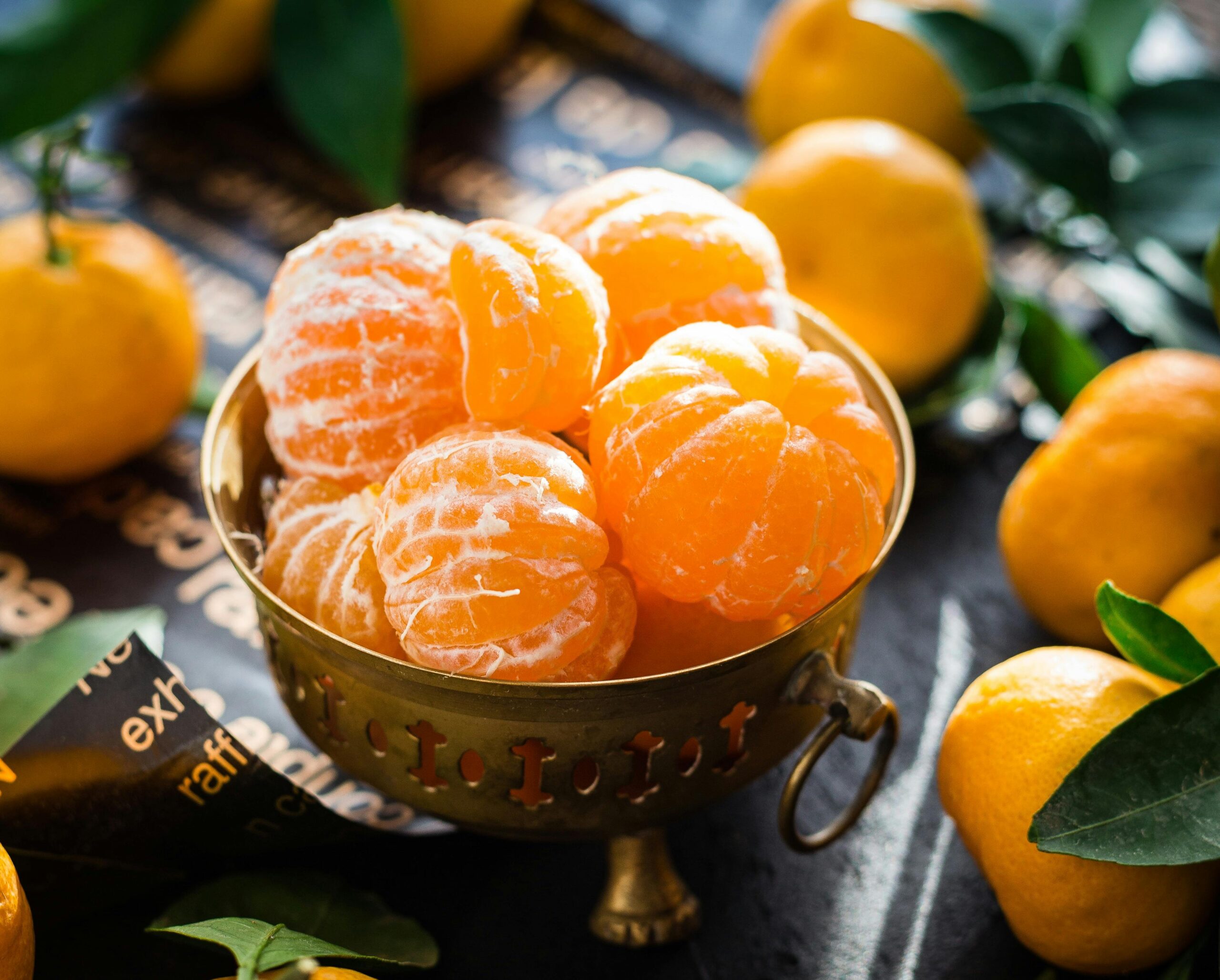 pexels photo 327098 327098 Vibrant peeled and whole tangerines in a rustic bowl highlighting freshness and health.
